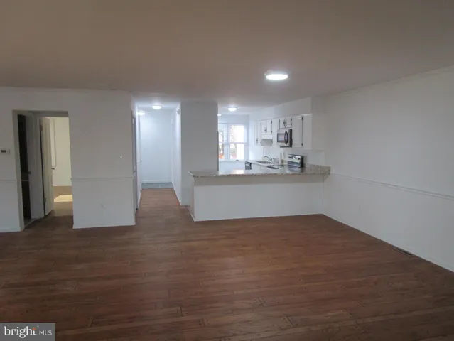 a kitchen with granite countertop white cabinets and a granite counter tops