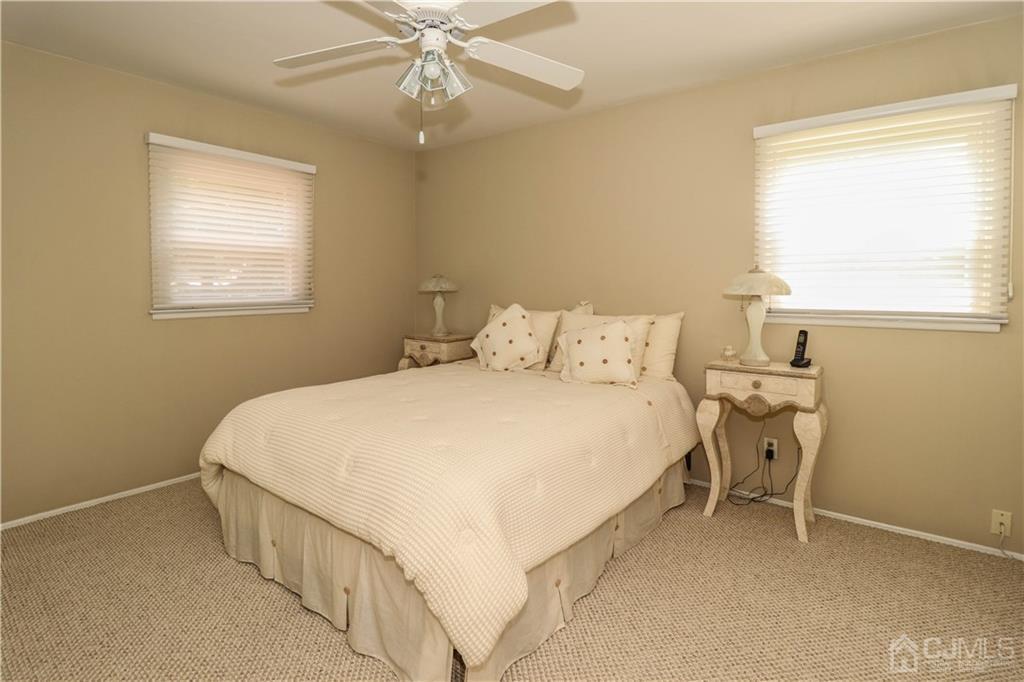 9 Meyer Road Edison, NJ 08817 - Photo 16 of 32 a bedroom with a bed and window