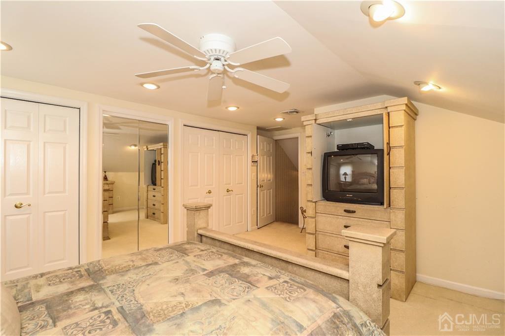 9 Meyer Road Edison, NJ 08817 - Photo 23 of 32 a bathroom with a sink and a mirror