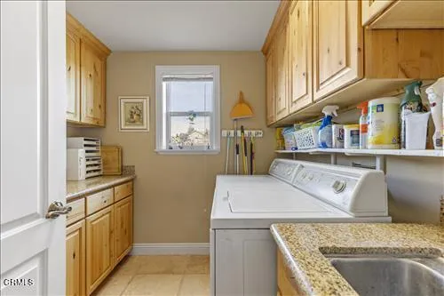 a view of a kitchen cabinets and a stove