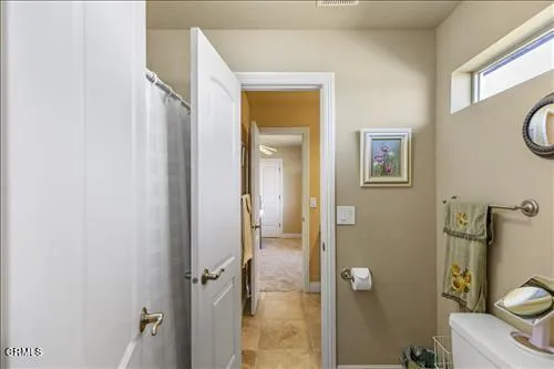 a en suite bathroom with a double vanity sink and a mirror