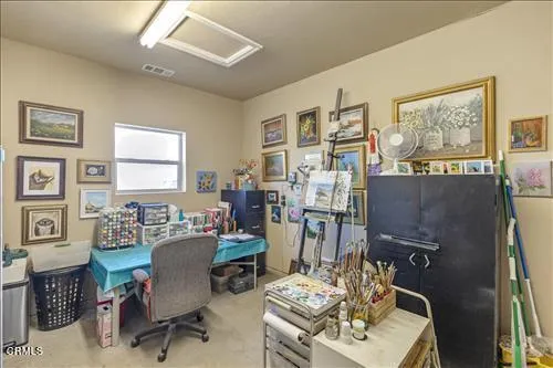 a view of a livingroom with furniture and a window