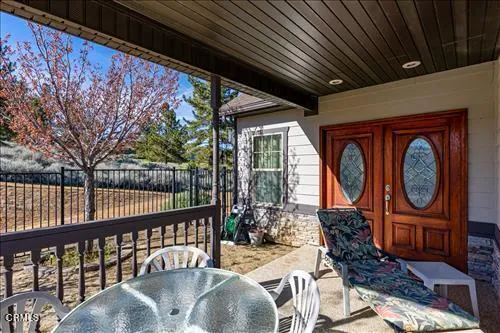 a view of a balcony with chairs