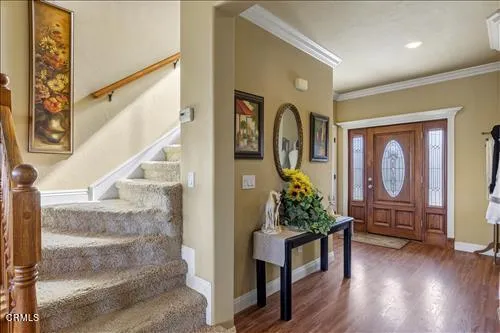 a porch with furniture and wooden floor