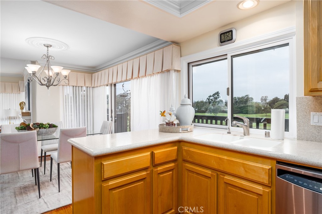 23 Flores, Unit 19 Irvine, CA 92612 - Photo 2 of 37 a kitchen with a sink and a large window