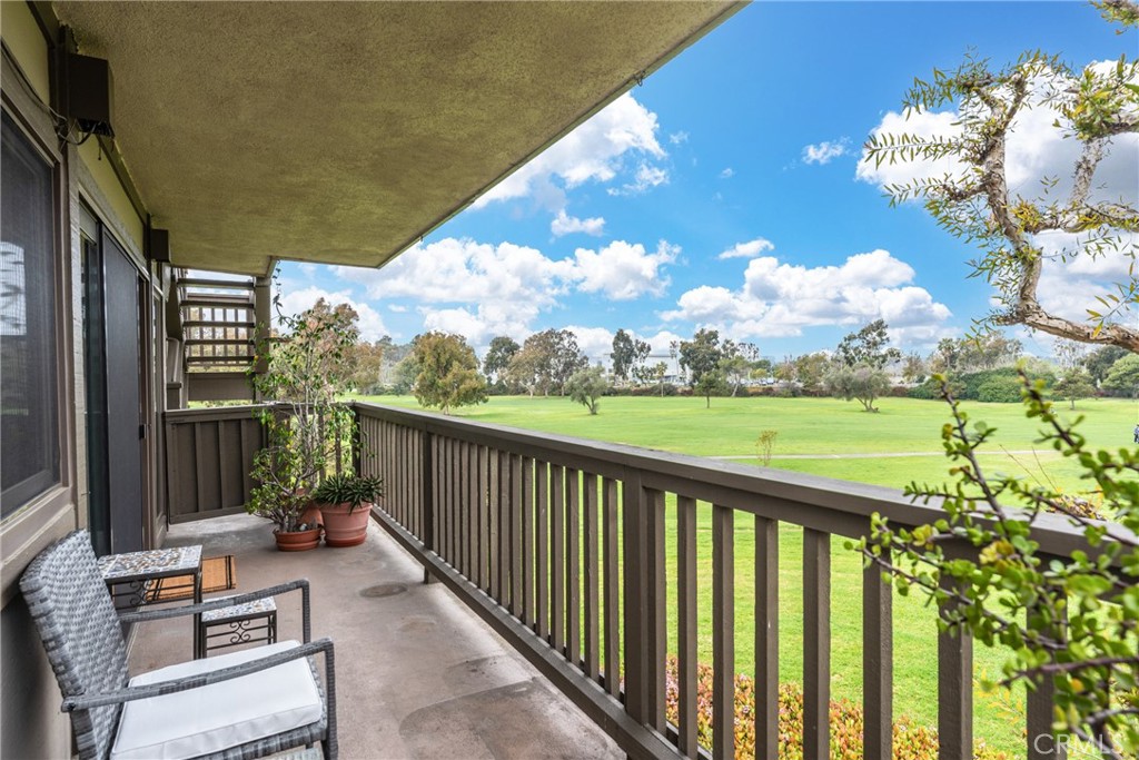 23 Flores, Unit 19 Irvine, CA 92612 - Photo 30 of 37 a view of a patio with a table & chairs