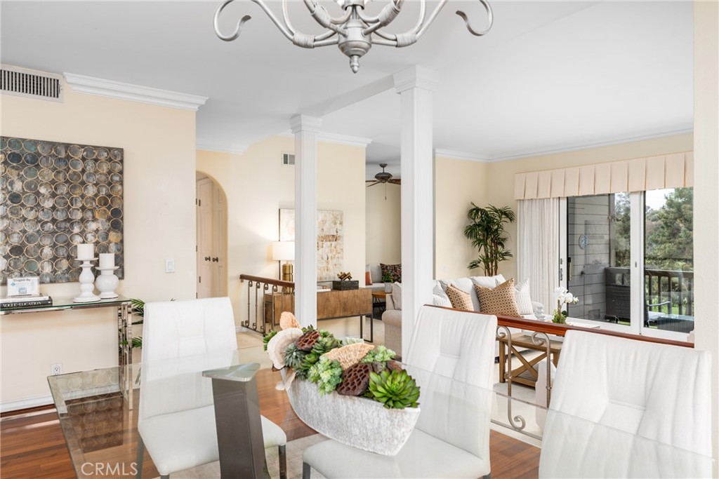 23 Flores, Unit 19 Irvine, CA 92612 - Photo 4 of 37 a living room with furniture and a large window