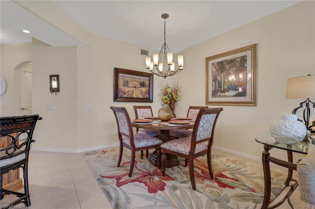 9281 Spring Run Boulevard, Unit 2607 Estero, FL 34135 - Photo 11 of 32 a dining room with furniture and window