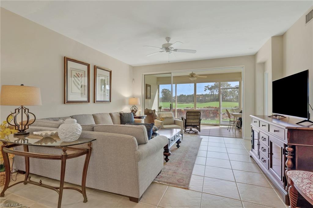 9281 Spring Run Boulevard, Unit 2607 Estero, FL 34135 - Photo 12 of 32 a living room with furniture and a flat screen tv