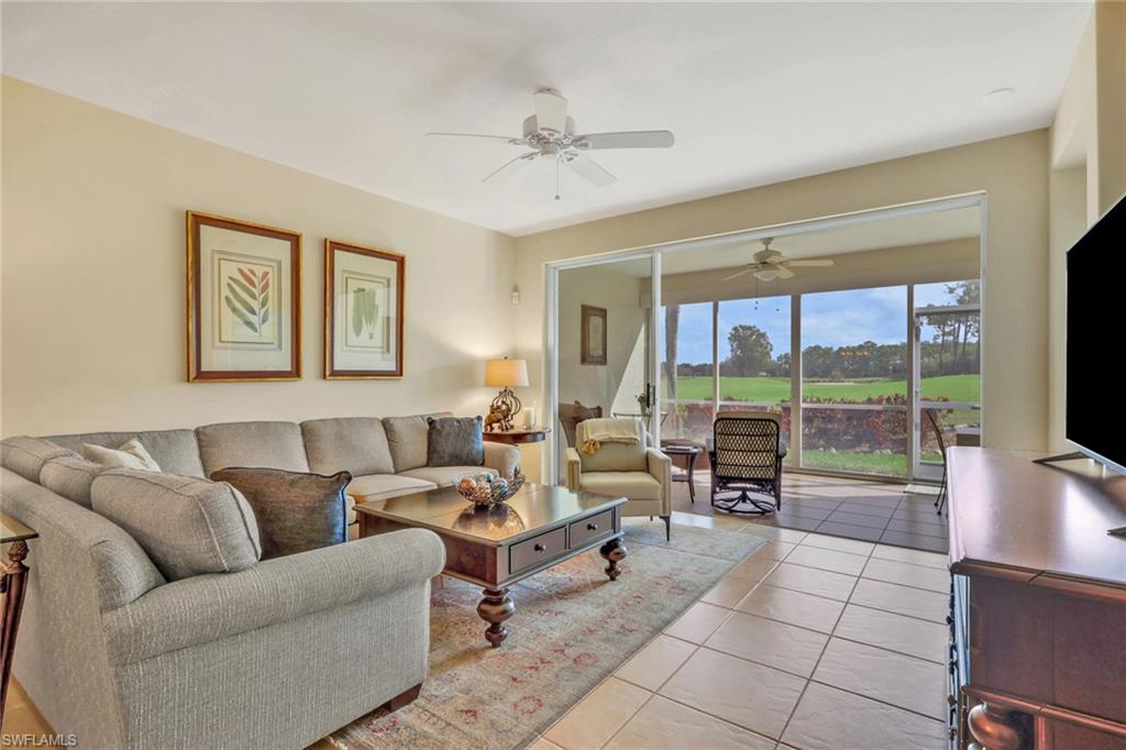 9281 Spring Run Boulevard, Unit 2607 Estero, FL 34135 - Photo 13 of 32 a living room with furniture and a flat screen tv