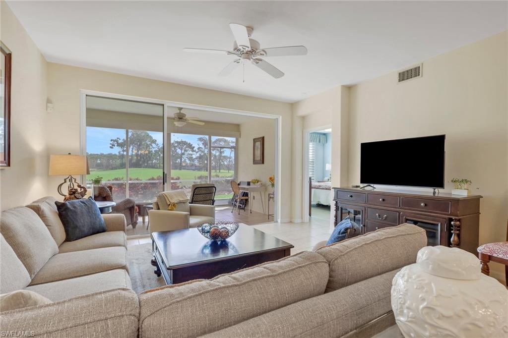 9281 Spring Run Boulevard, Unit 2607 Estero, FL 34135 - Photo 14 of 32 a living room with furniture and a flat screen tv