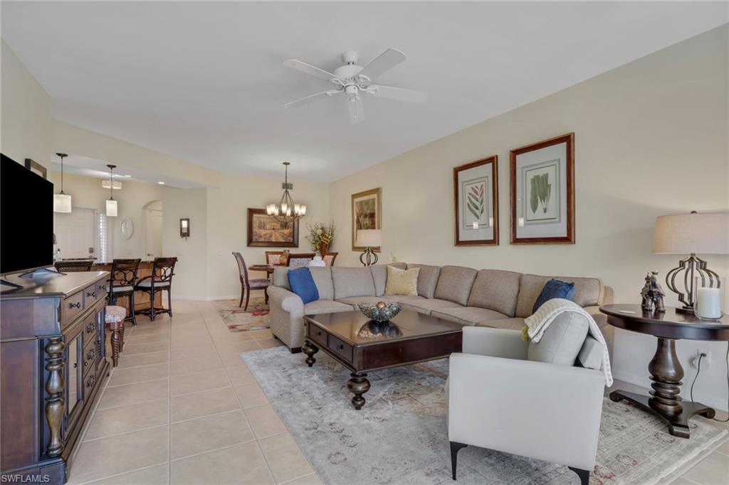 9281 Spring Run Boulevard, Unit 2607 Estero, FL 34135 - Photo 15 of 32 a living room with furniture and a flat screen tv