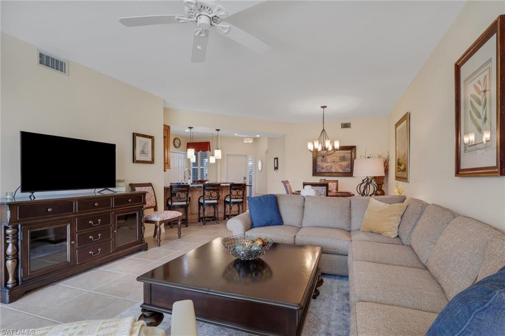 9281 Spring Run Boulevard, Unit 2607 Estero, FL 34135 - Photo 16 of 32 a living room with furniture and a flat screen tv