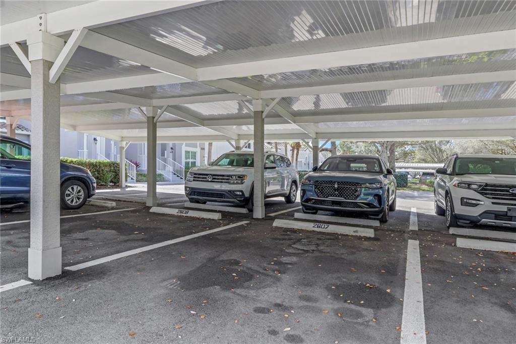 9281 Spring Run Boulevard, Unit 2607 Estero, FL 34135 - Photo 3 of 32 a view of parking area