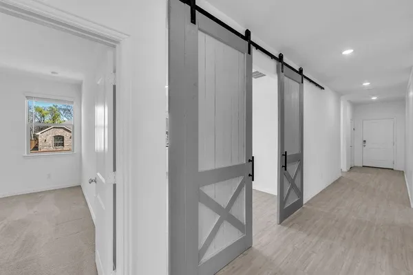 a view of an entryway with wooden floor