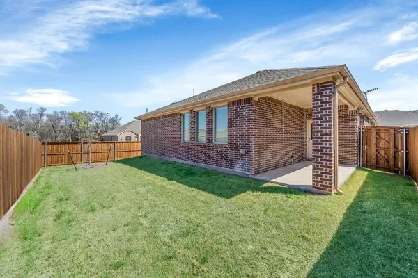 a view of backyard with green space