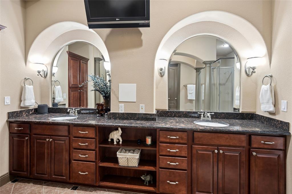 835 Rockingham Drive Irving, TX 75063 - Photo 17 of 27 a bathroom with a granite countertop double vanity sink and a