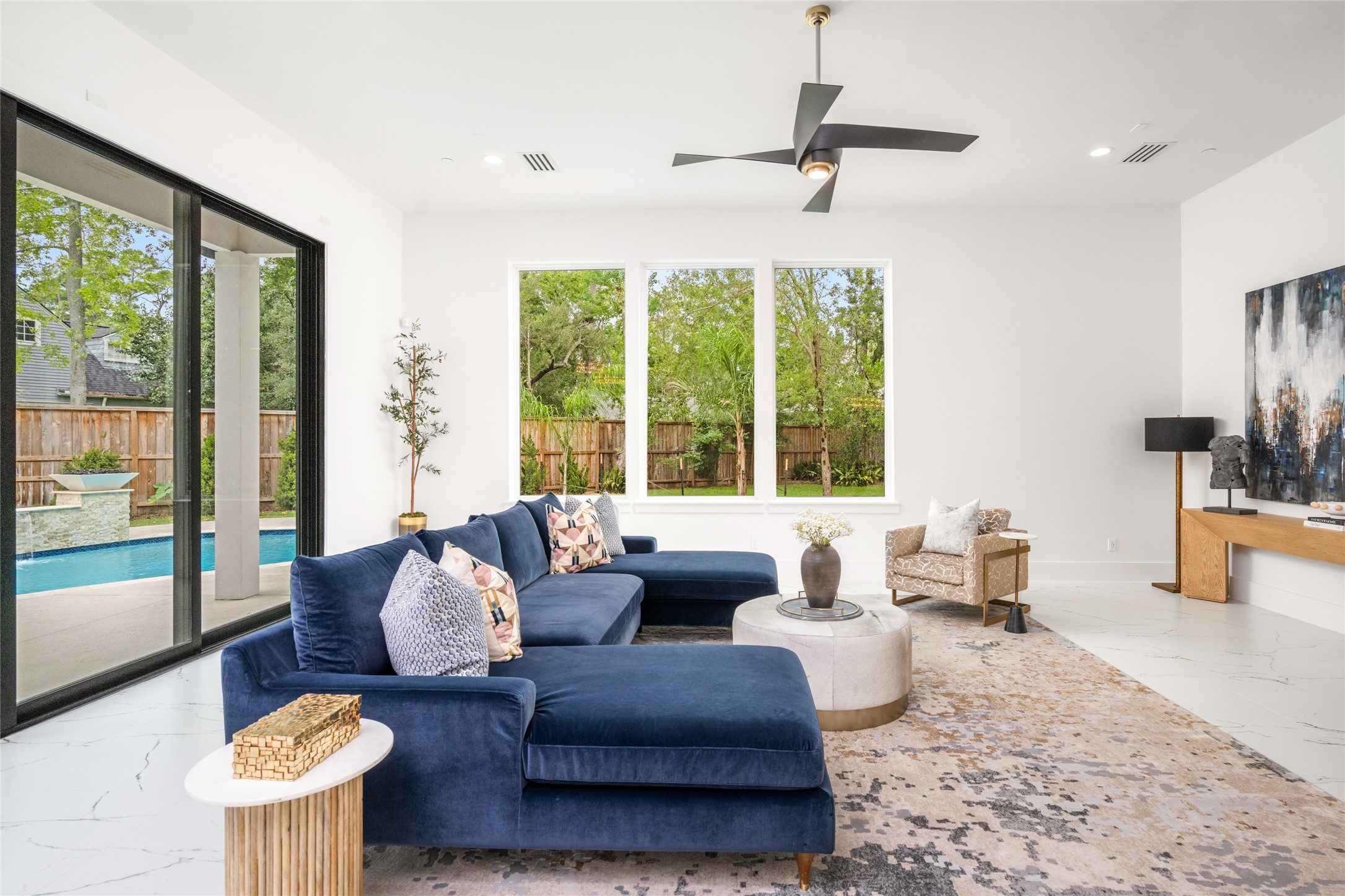 625 Piney Point Road Houston, TX 77024 - Photo 7 of 42 a living room with furniture and a large window