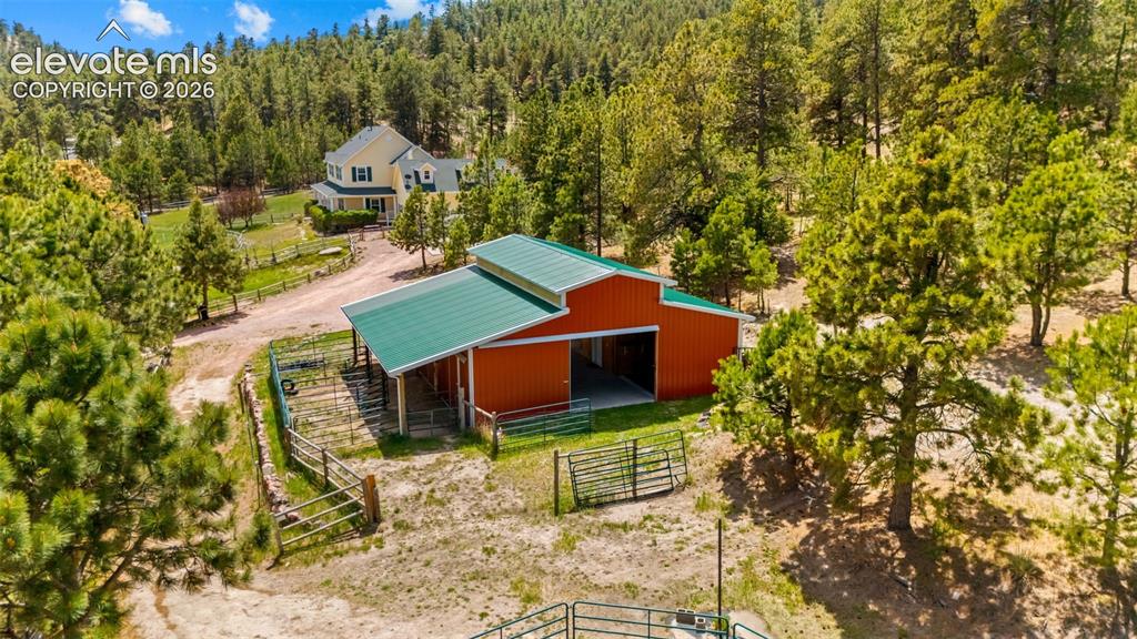 16540 Mesquite Road Peyton, CO 80831 - Photo 41 of 50 a backyard of a house with table and chairs