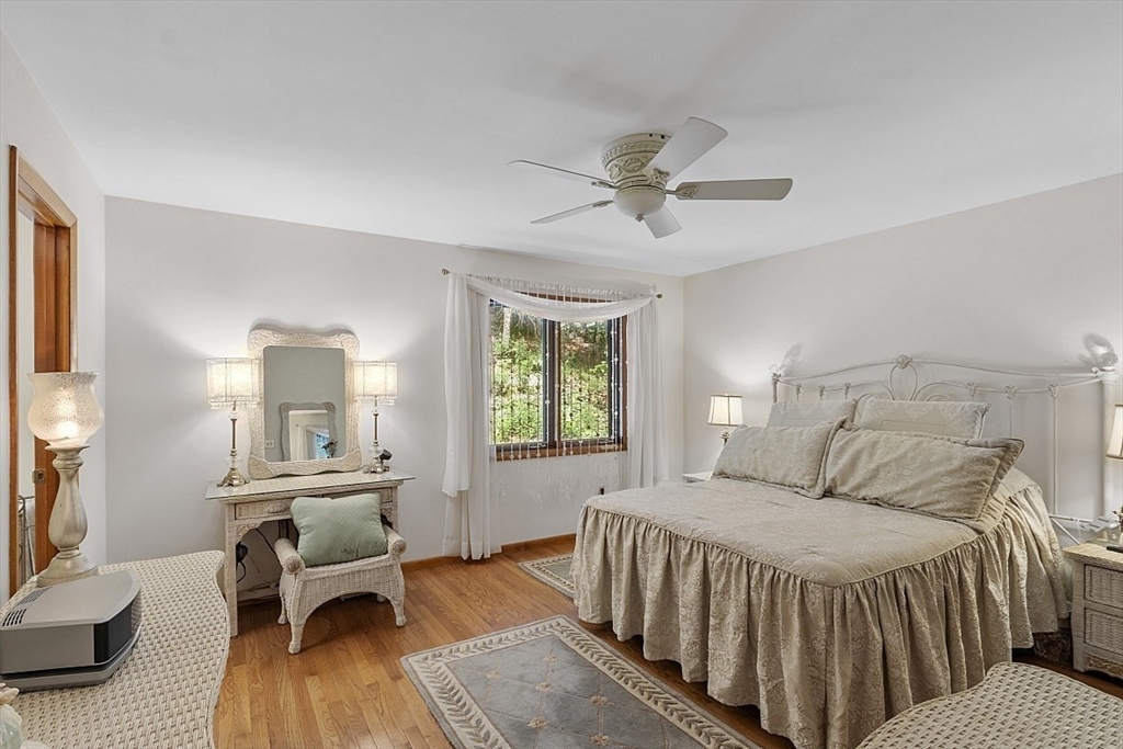 23 Pingree Farm Road Georgetown, MA 01833 - Photo 18 of 30 a bedroom with a bed and wooden floor