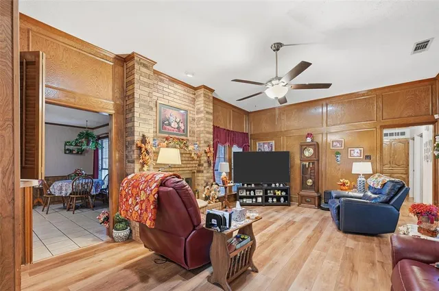 a view of a livingroom with furniture and a flat screen tv