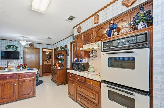 a kitchen with stainless steel appliances a stove and a refrigerator