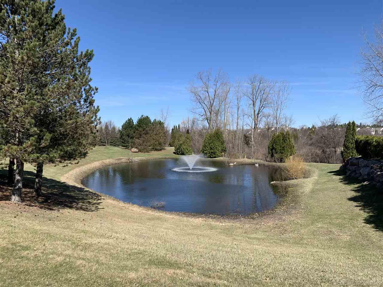 3620 Tremonte Circle Rochester, MI 48306 - Photo 18 of 18 A fountain on one of the many ponds.
