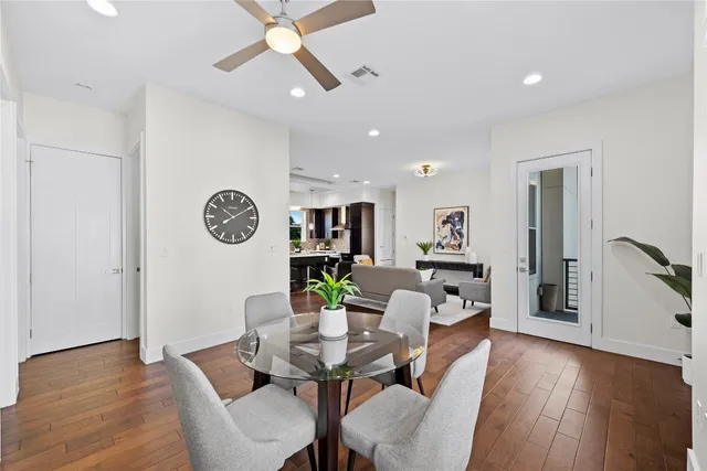 a view of a dining room with furniture and wooden floor