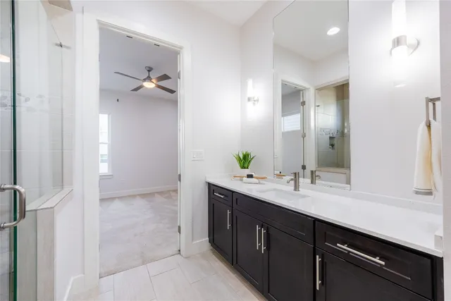 a bathroom with a double vanity sink and mirror