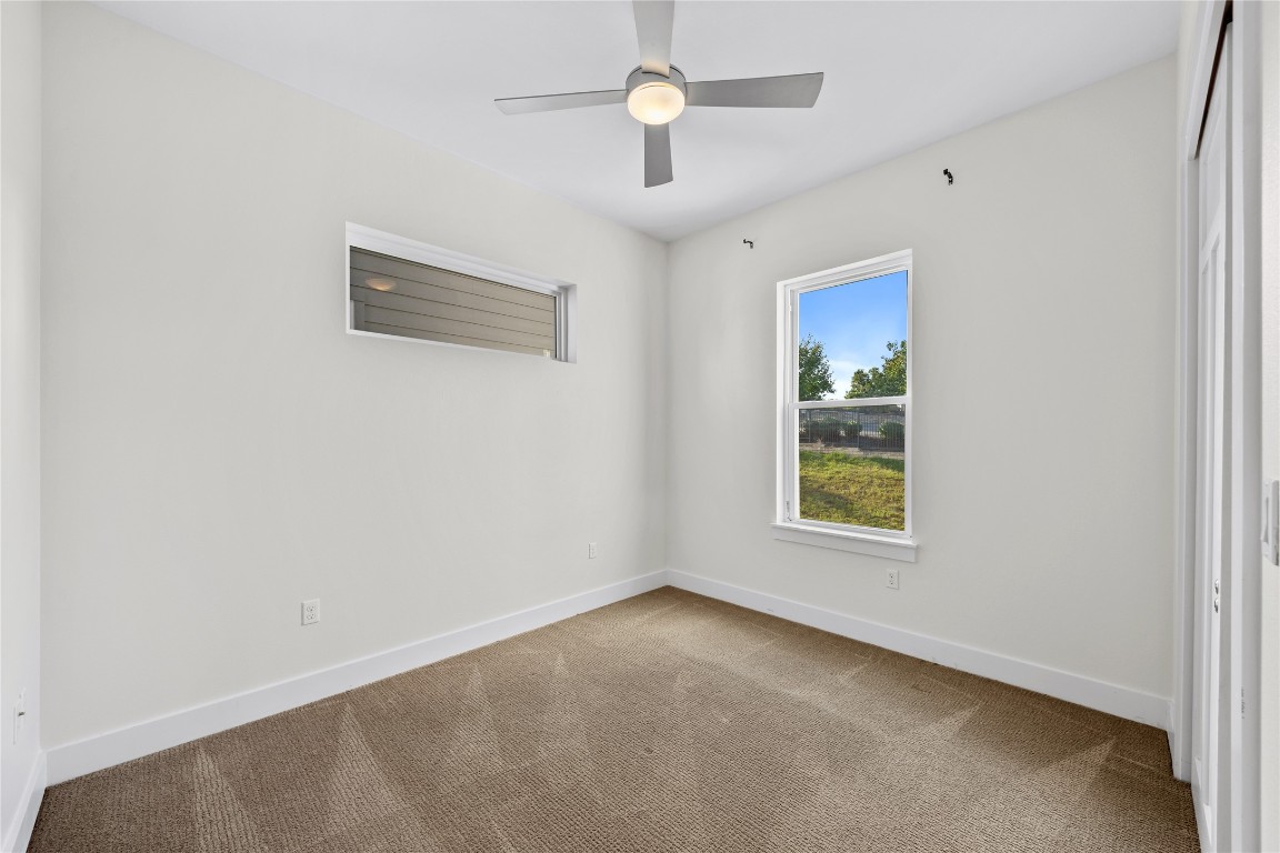 4300 Mansfield Dam Road, Unit 621 Austin, TX 78734 - Photo 17 of 34 an empty room with windows and fan