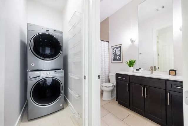 a bathroom with a toilet a sink and a mirror