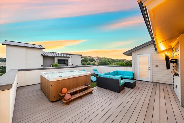 a view of balcony with couch and wooden floor