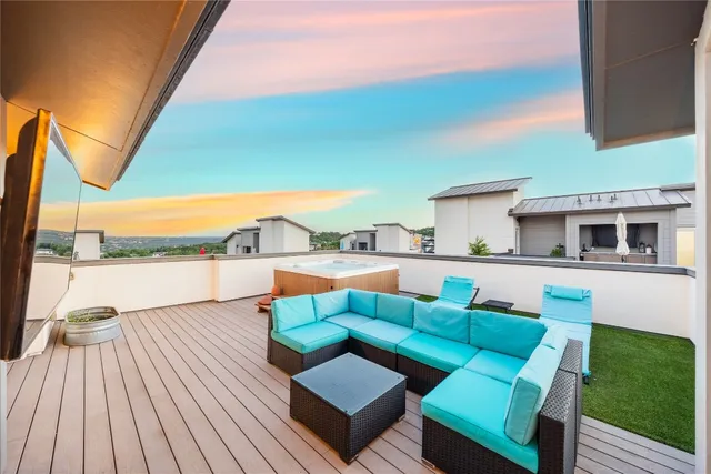 a view of living room kitchen with furniture and wooden floor