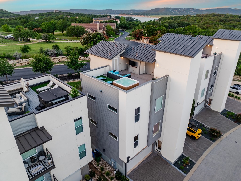 4300 Mansfield Dam Road, Unit 621 Austin, TX 78734 - Photo 27 of 34 an aerial view of a house with roof deck and city view