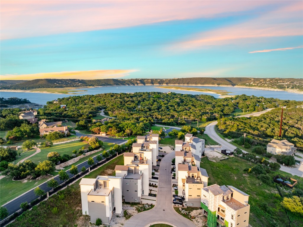 4300 Mansfield Dam Road, Unit 621 Austin, TX 78734 - Photo 31 of 34 an aerial view of a city with lots of residential buildings ocean and mountain view in back
