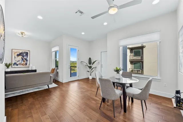 a view of a dining room with furniture and wooden floor