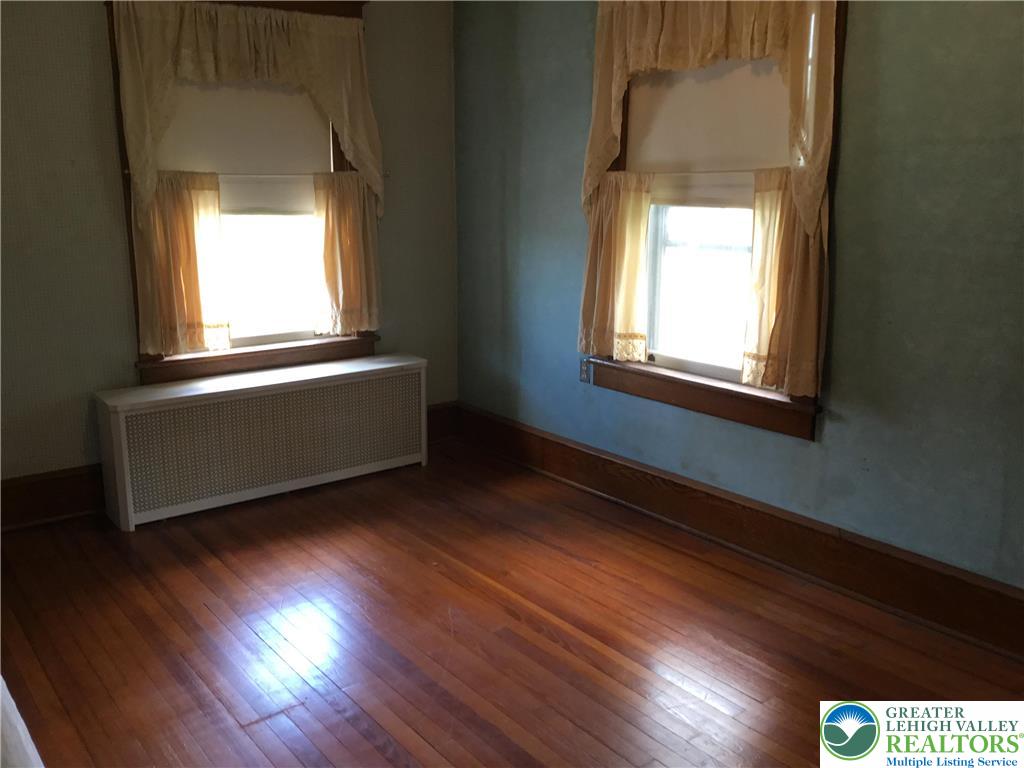 1105 Main Street Slatington, PA 18080 - Photo 22 of 31 Natural light illuminates rich hardwood floors, creating a warm and inviting atmosphere.