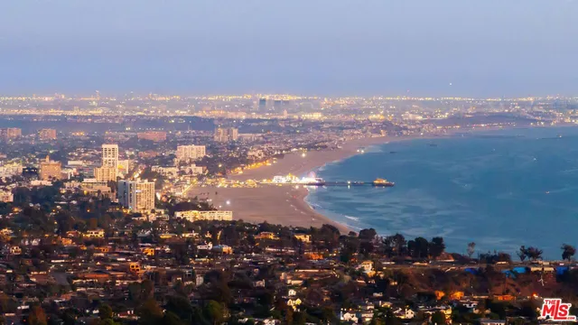 a front view of residential houses with yard and swimming pool