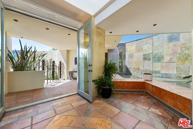 a large kitchen with a large counter top appliances and cabinets