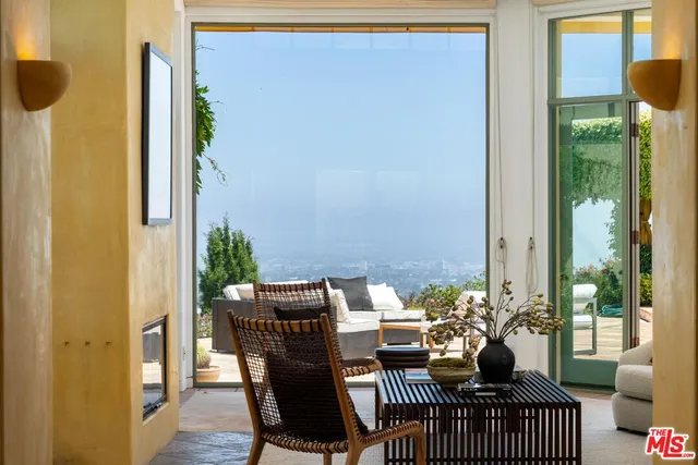 a large white kitchen with a large window