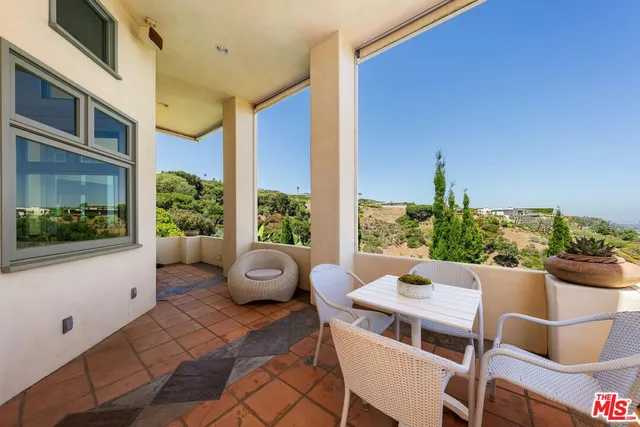 a picture of houses with city view