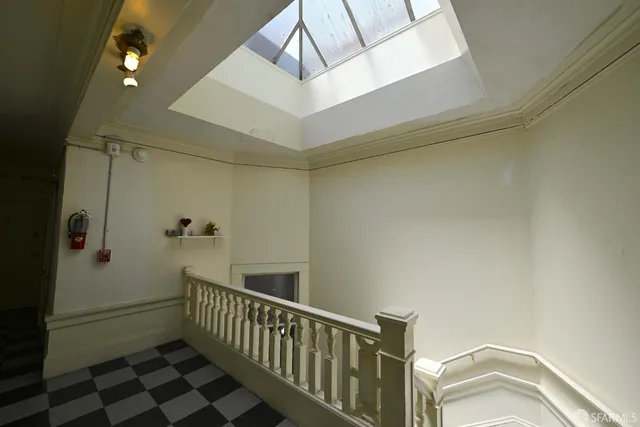 a view of a hallway with a white walls