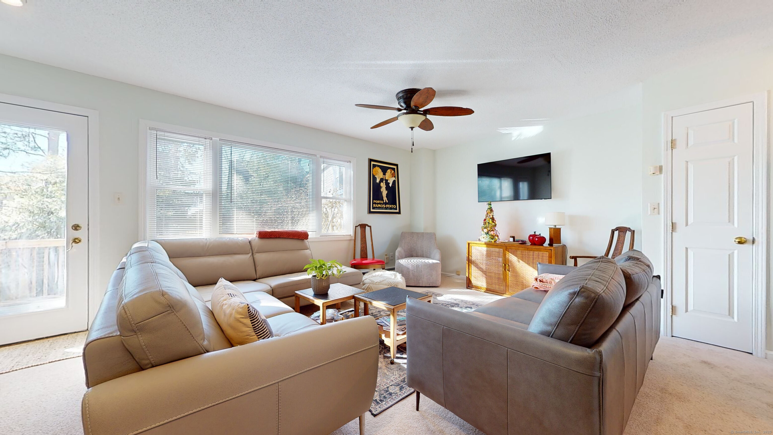 23 Village Road, Unit 23 Milford, CT 06460 - Photo 2 of 16 a living room with furniture ceiling fan and a window