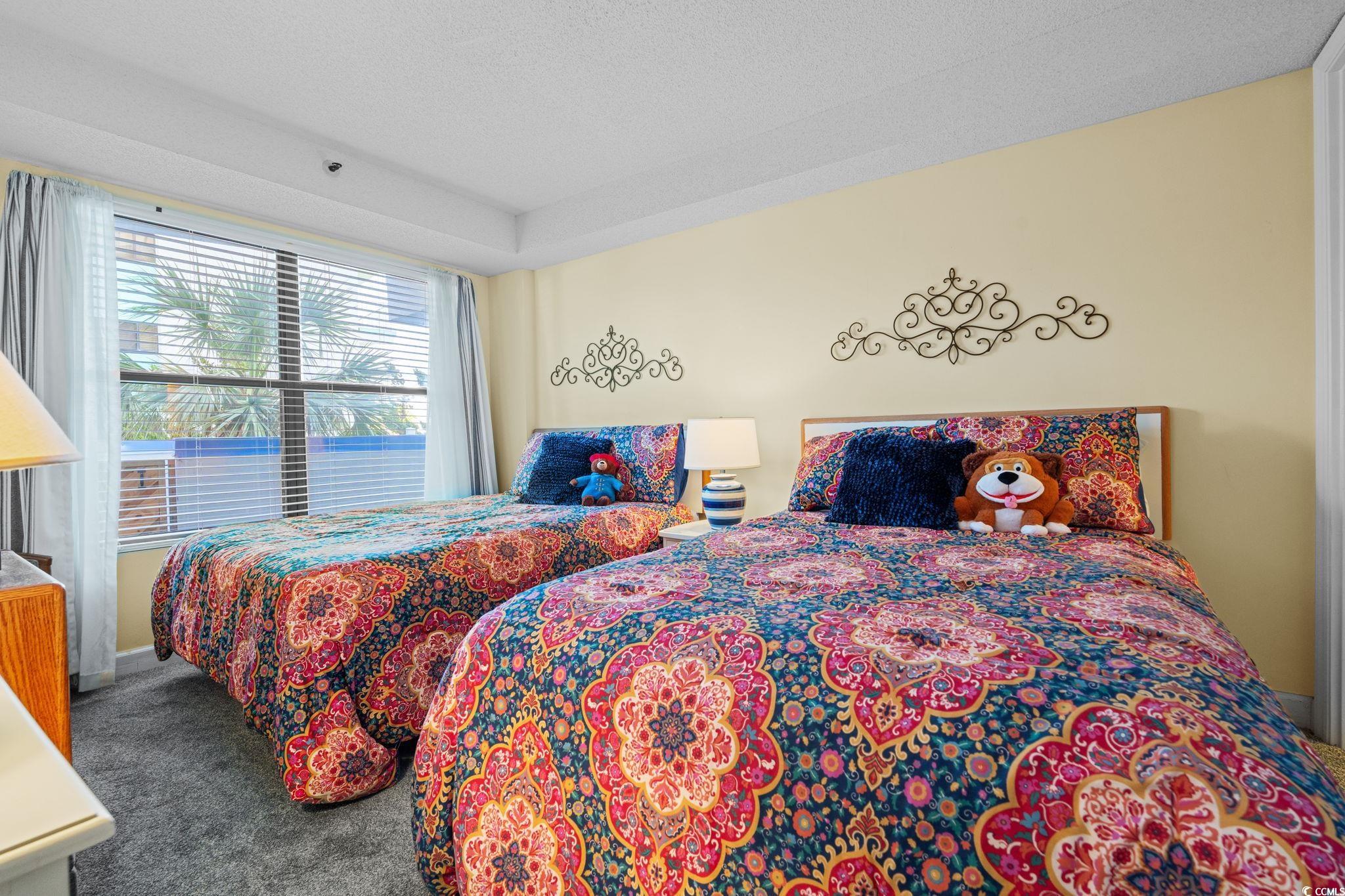5511 North Ocean Boulevard, Unit 208 Myrtle Beach, SC 29577 - Photo 21 of 37 Hall with a textured ceiling
