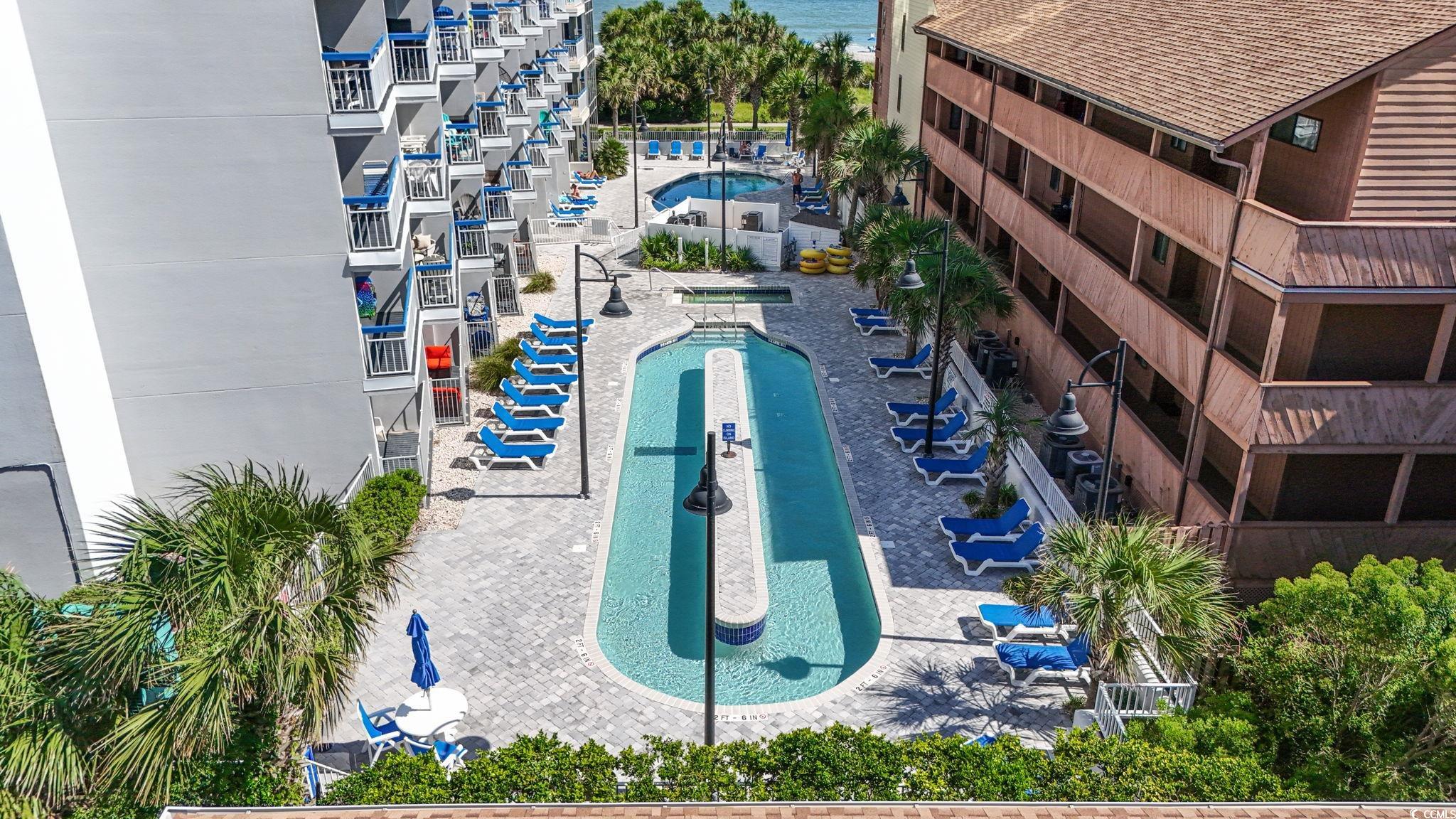 5511 North Ocean Boulevard, Unit 208 Myrtle Beach, SC 29577 - Photo 26 of 37 Community pool featuring a hot tub