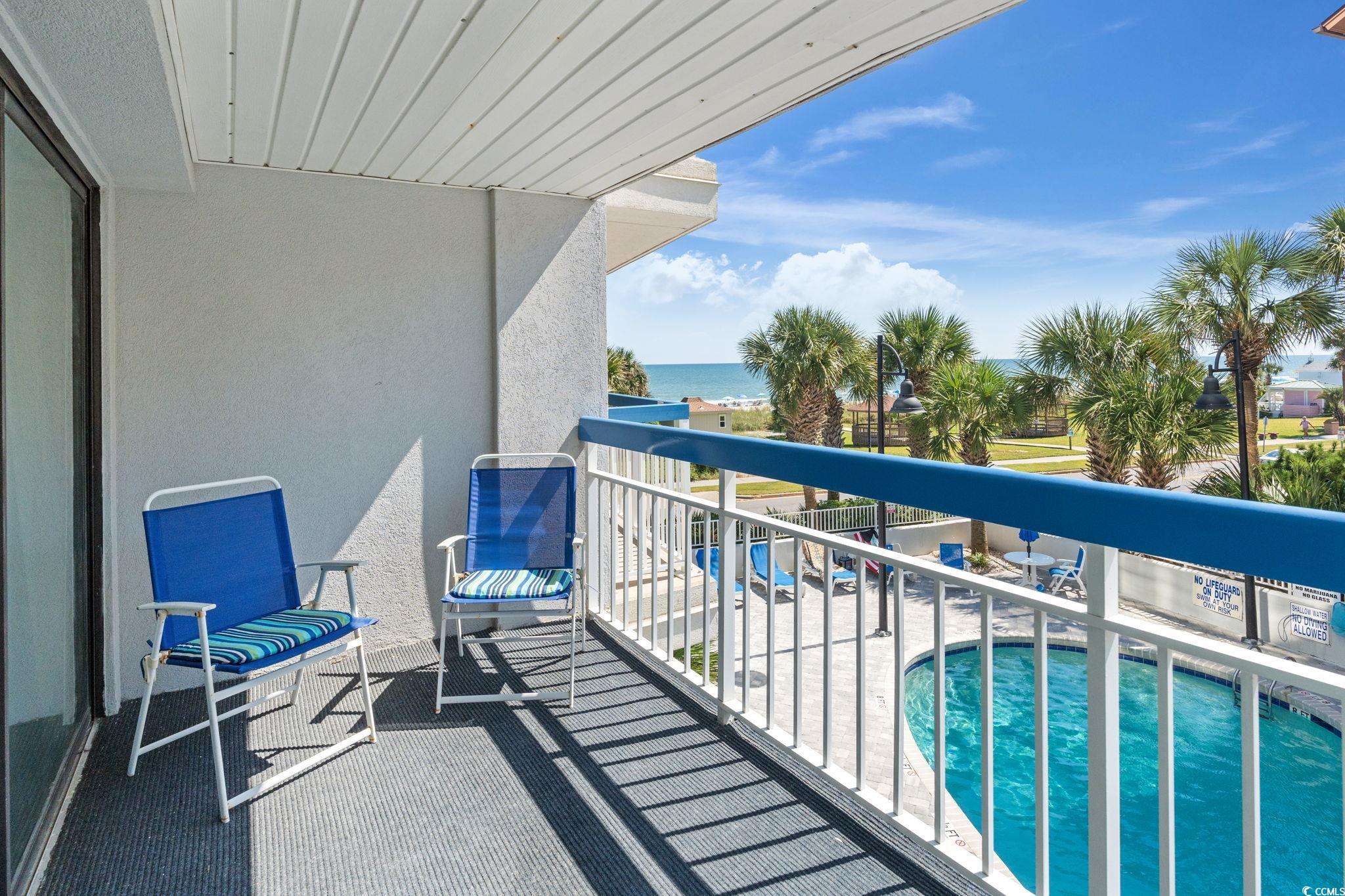 5511 North Ocean Boulevard, Unit 208 Myrtle Beach, SC 29577 - Photo 33 of 37 Community pool with a water view, a patio, and a balcony