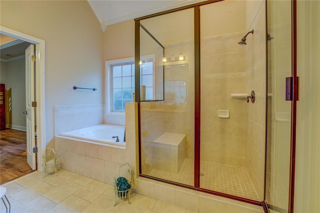 10155 Malcolm Drive Covington, GA 30014 - Photo 21 of 32 a bathroom with a shower and a tub