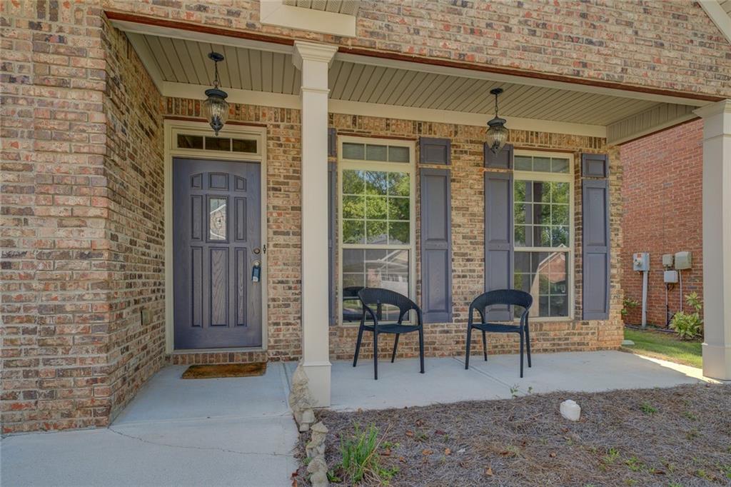 10155 Malcolm Drive Covington, GA 30014 - Photo 31 of 32 a view of living room filled with furniture and large windows