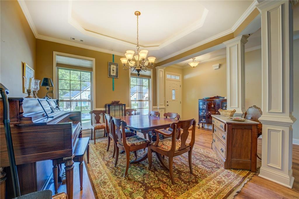 10155 Malcolm Drive Covington, GA 30014 - Photo 5 of 32 a view of a dining room with furniture window and wooden floor