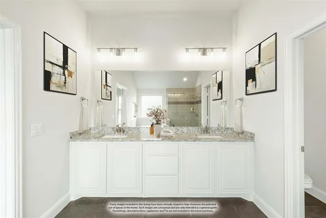 a bathroom with a sink vanity granite and a mirror
